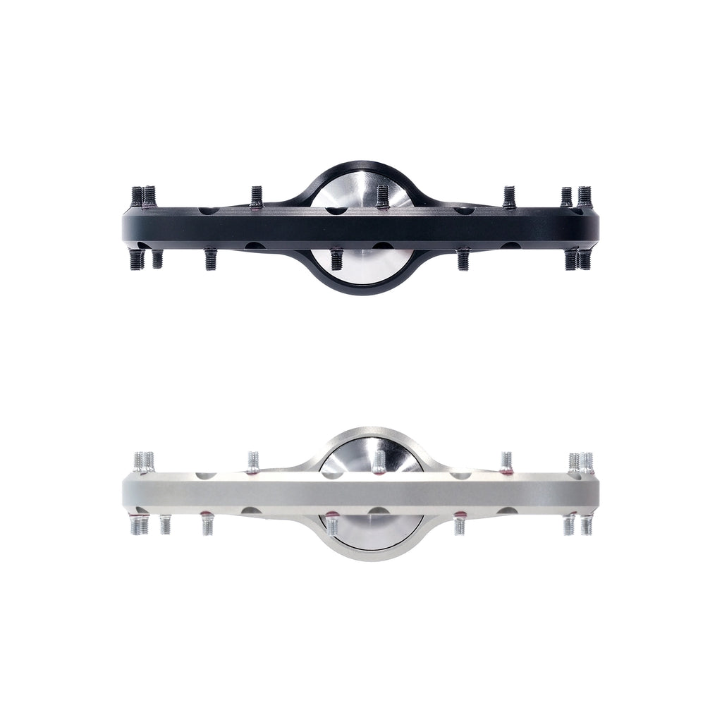 Outlier Void MTB platform pedal shown in Black and Raw, front view